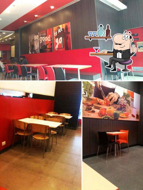 Take a seat at one of the tables at KFC
