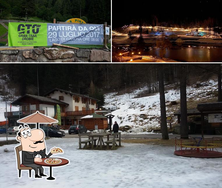 Puoi goderti l'aria fresca da seduto all'esterno di Bar Pineta