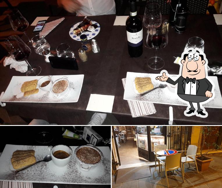 La foto della interni e bevanda di Antica Osteria Di Bazzino
