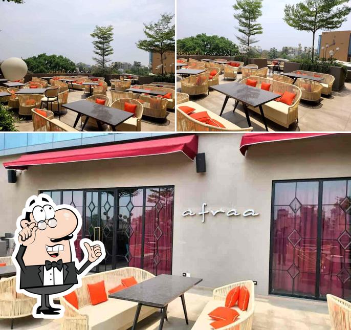 Take a seat at one of the tables at Afraa