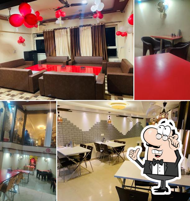 Take a seat at one of the tables at Modi Family Restaurant