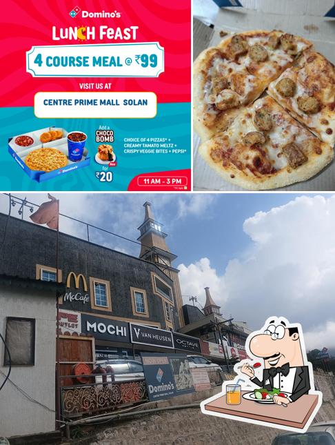 The photo of food and exterior at Domino's Pizza Centre Prime Mall, Solan