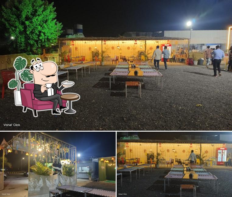 Take a seat at one of the tables at Krushnam Kathiyawadi