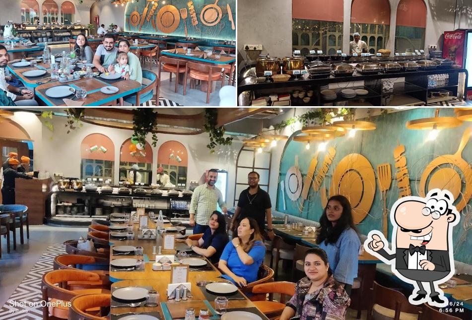 Take a seat at one of the tables at Grill kitchen Ultimate BBQ Sindhu Bhavan