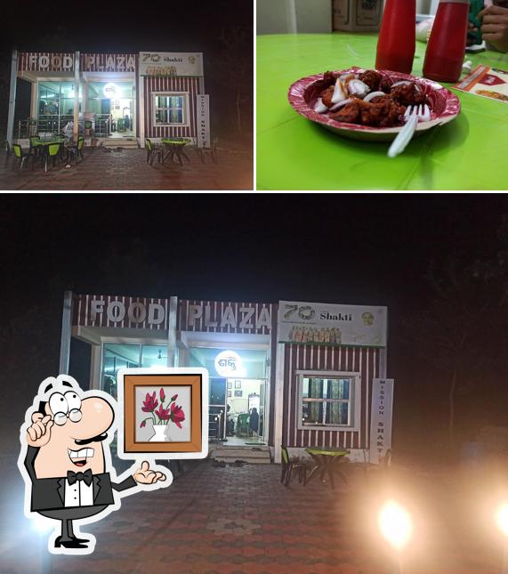 This is the photo displaying interior and food at Mission Shakti food plaza, Kuchinda