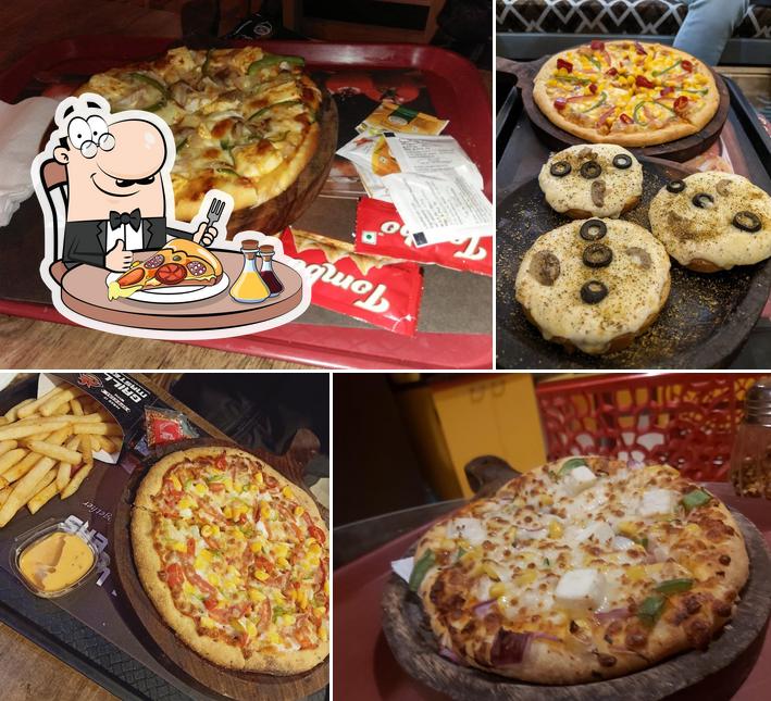 Try out pizza at Grill Masters Sri Ganganagar