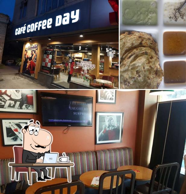 Take a seat at one of the tables at Café Coffee Day