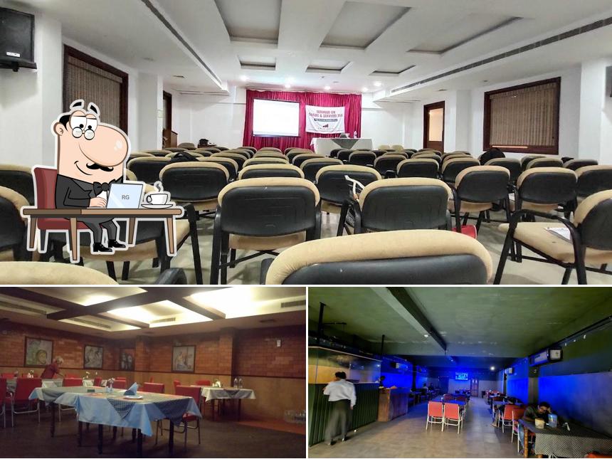 Take a seat at one of the tables at Central Hotel Thrissur