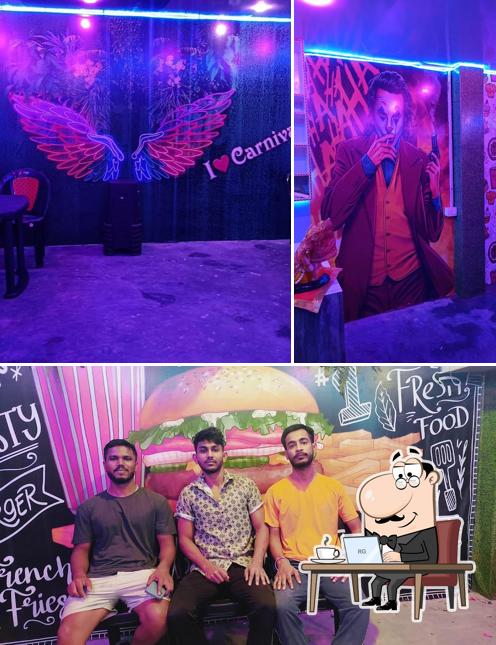 Take a look at the picture showing interior and food at The Carnival