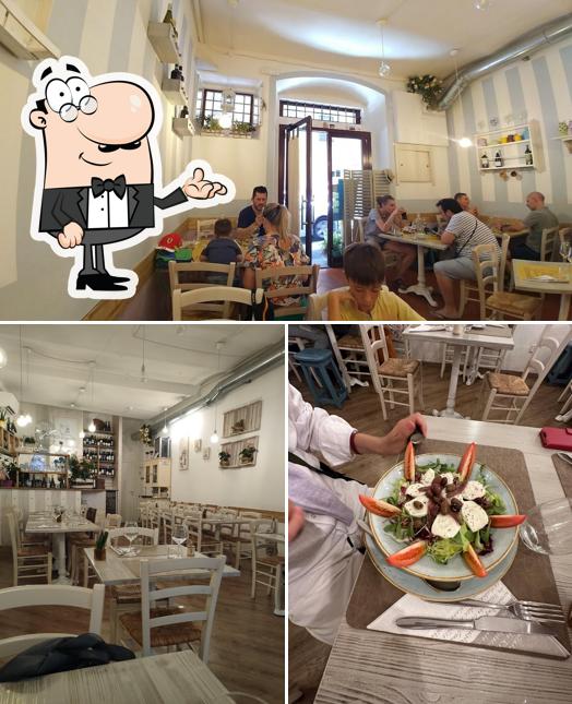 Siediti a un tavolo di Taverna Il Gozzoviglio