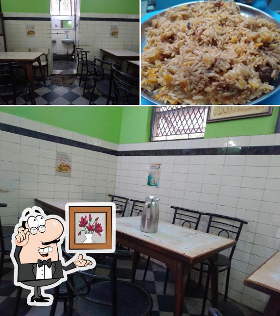 This is the picture displaying interior and food at Mahaboob Basha Mutton Biryani Centre
