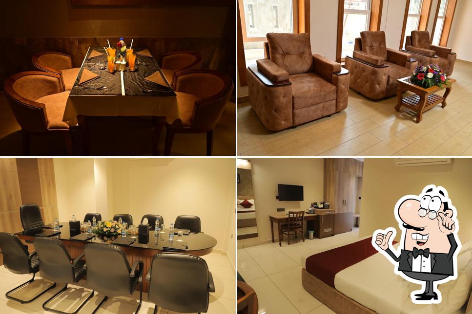 Take a seat at one of the tables at Alankar Tourist Bunglow