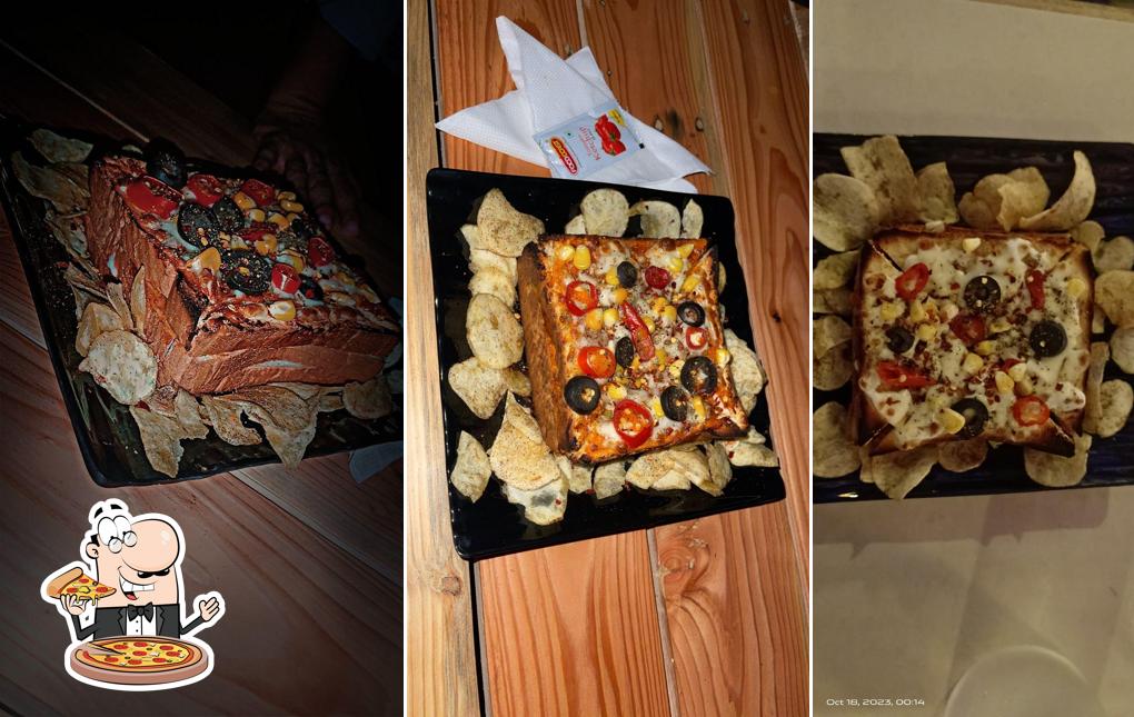 Get pizza at Ambavadiyu Cafe