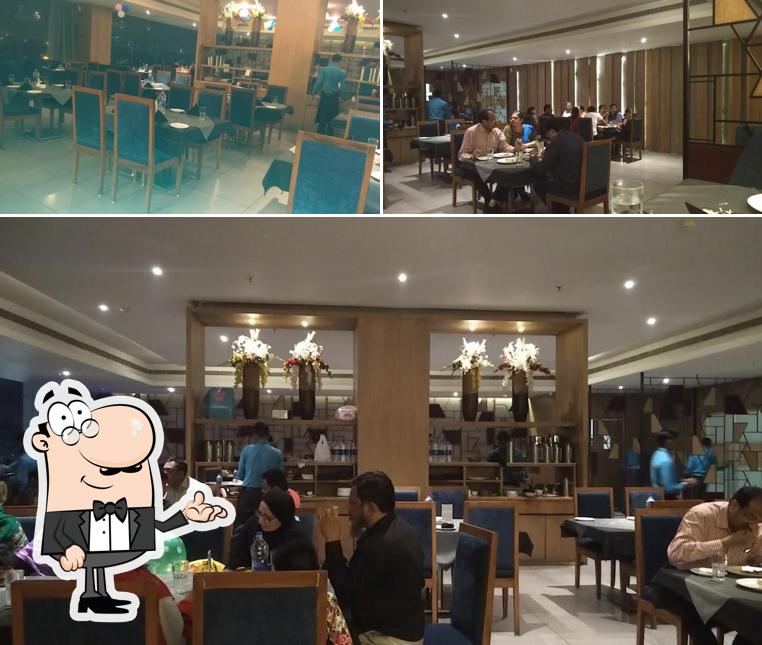 Take a seat at one of the tables at Dil Se Re Restaurant