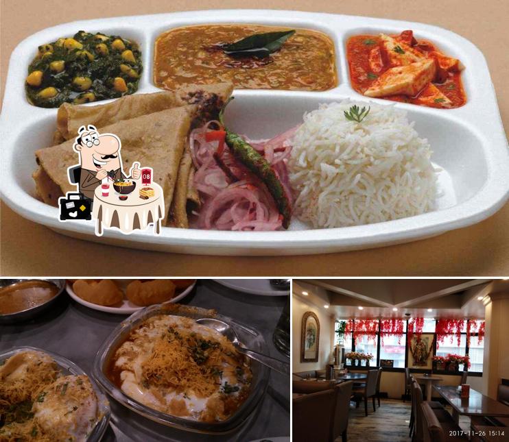 Take a look at the photo displaying food and dining table at Kailash Parbat Hindu Hotel Restaurants