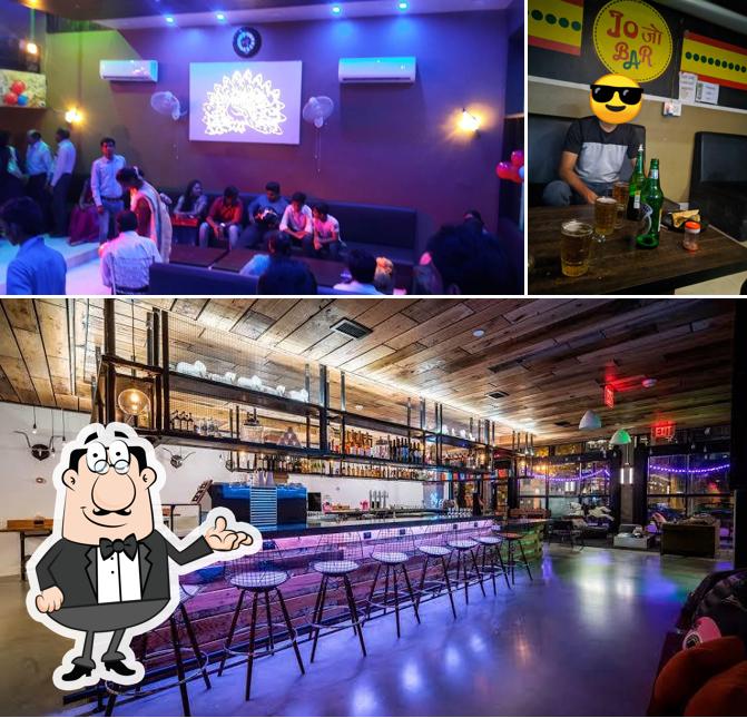 Take a seat at one of the tables at Paradise Bar and Restaurant