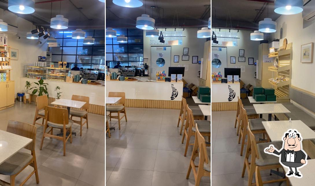 Take a seat at one of the tables at Blue Tokai Coffee Roasters Sector 35 Chandigarh