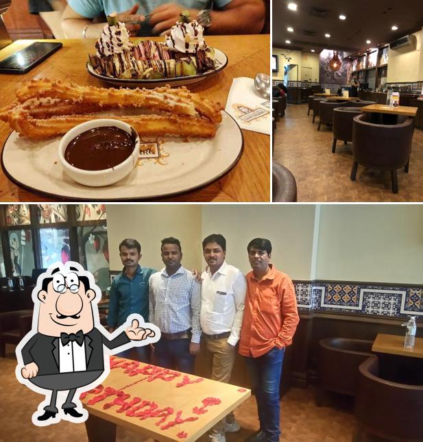 Take a seat at one of the tables at Chocolateria San Churro