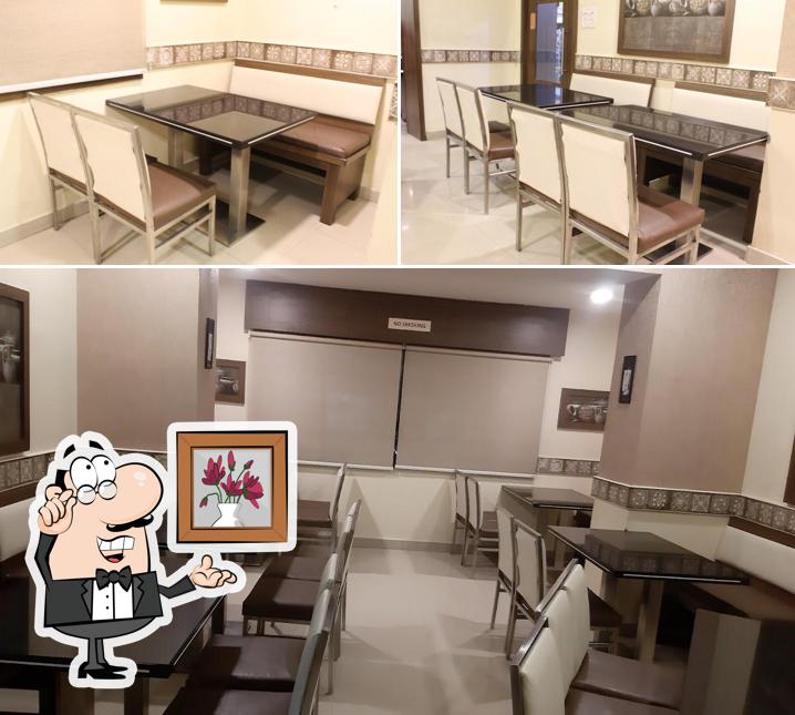 Take a seat at one of the tables at Hotel WoodSide