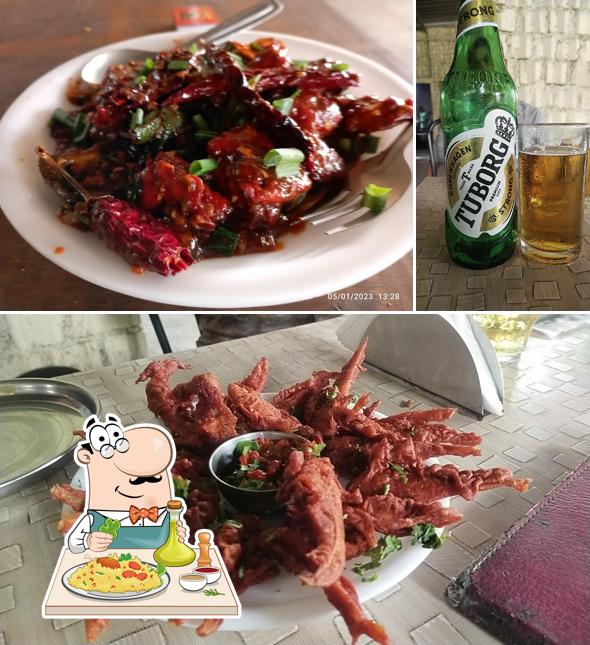 This is the photo depicting food and beer at Yuvi Dhaba