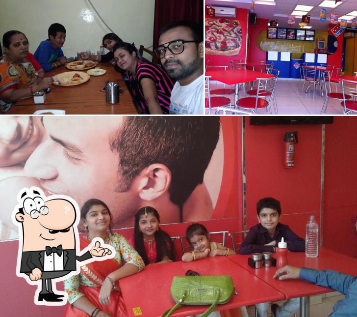 The image of interior and dining table at Domino's Pizza Paras Society, Jamnagar