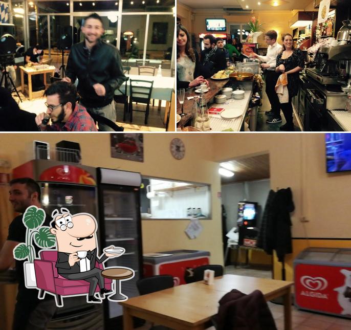 Dai un'occhiata agli interni di Pizzeria L'Angolo Di Poppy Di Marcotti Roberto