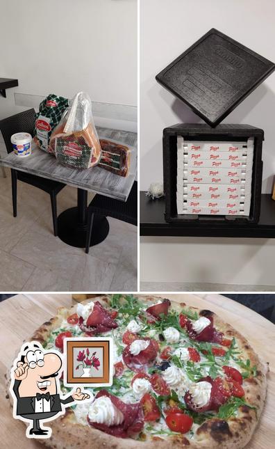 Dai un’occhiata alla immagine che raffigura la interni e pizza di CALUMA BAR - PIZZERIA