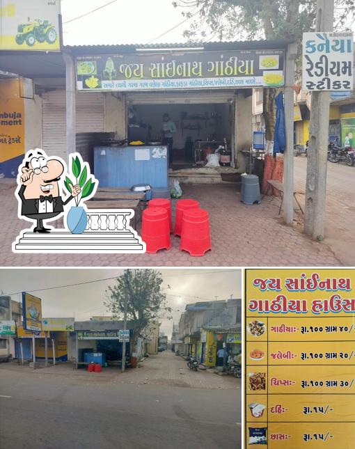 Check out the image displaying exterior and food at Jay Sainath Gathiya House