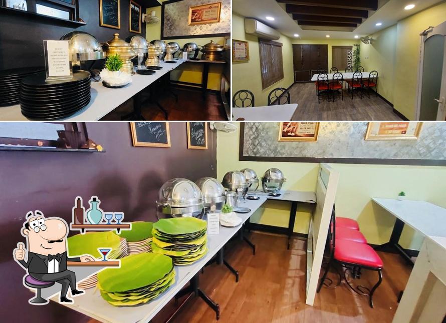 Take a seat at one of the tables at Waalai Aahar (Multi-cuisine Restaurant & Caterers)