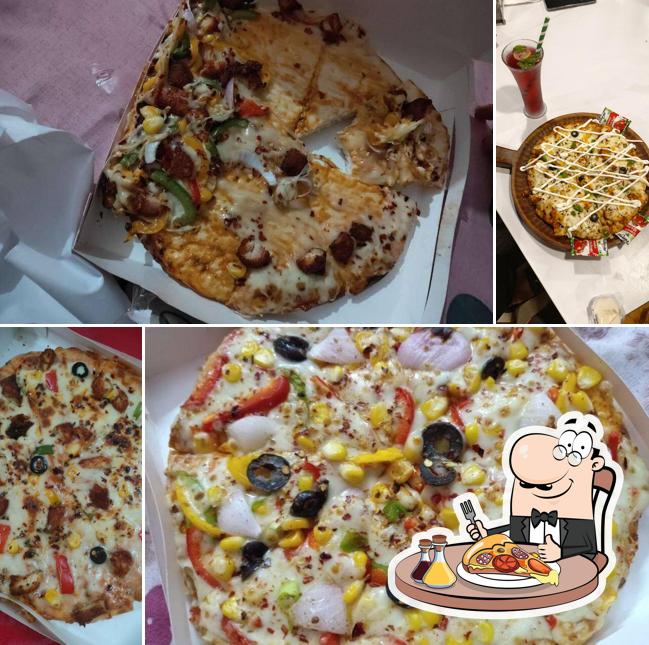 Try out pizza at AL-ZAIK