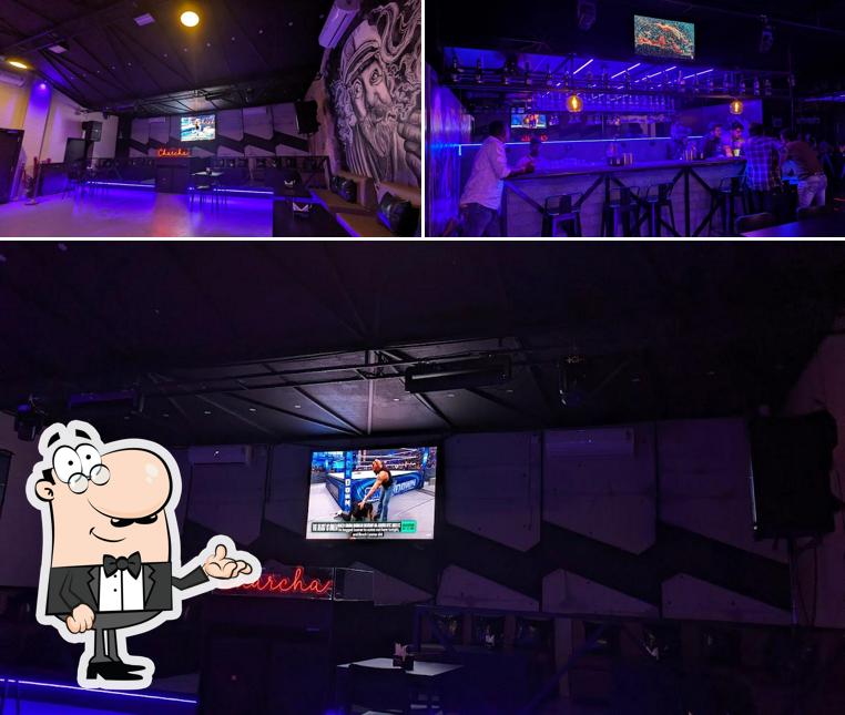 Take a seat at one of the tables at Charcha Lounge & Bar