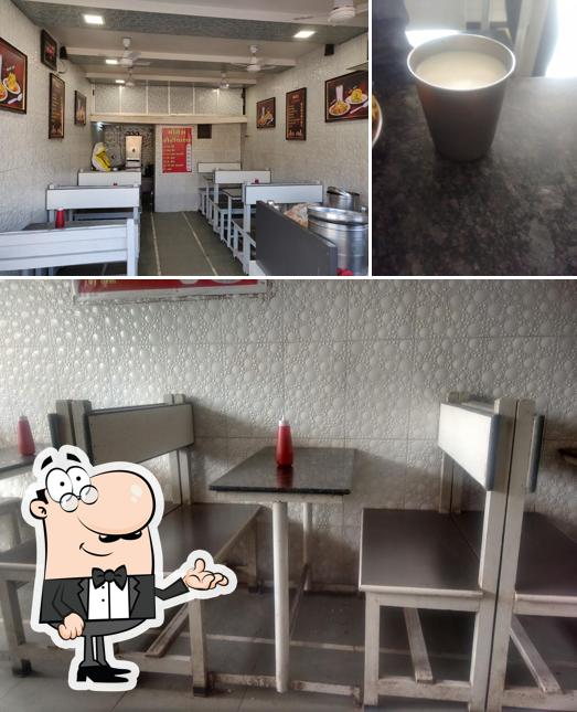 Take a look at the photo displaying interior and beverage at Yogesh Roti Wala