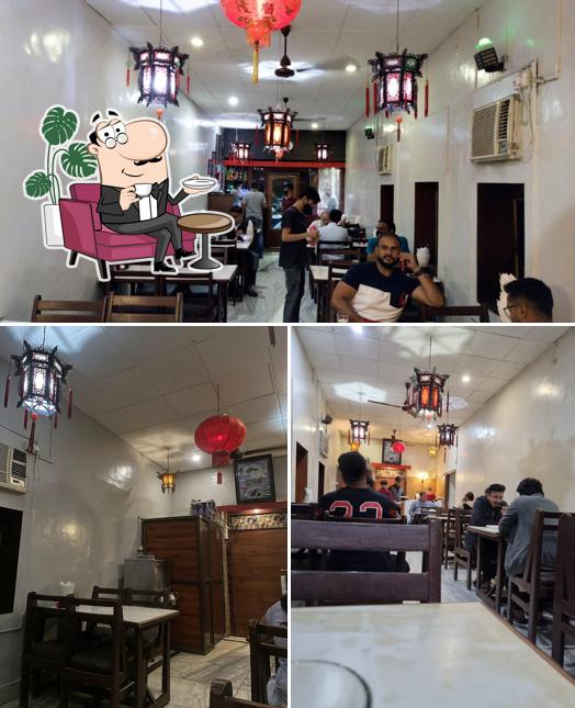 Take a seat at one of the tables at Clock Tower Chinese Restaurant