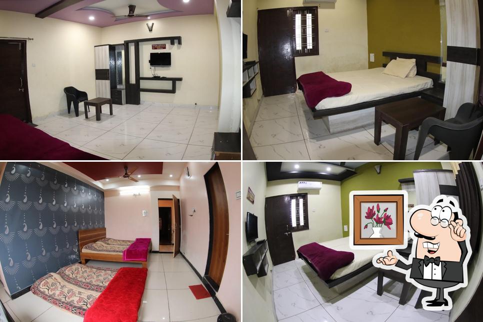 Take a seat at one of the tables at Hotel Utsav Palace Best Hotel In Fatehnagar Best Family Restaurant In Fatehnagar Best Resort