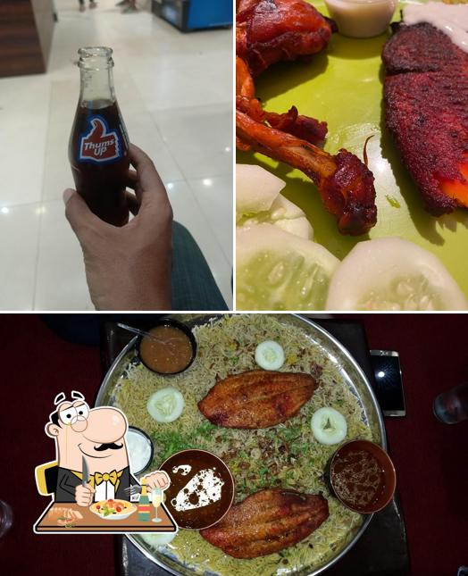 Check out the photo depicting food and beer at Mandi King Arabian Restaurant