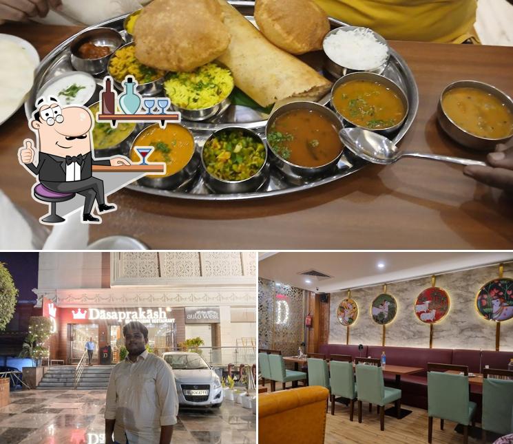 Take a seat at one of the tables at Dasaprakash - Janakpuri