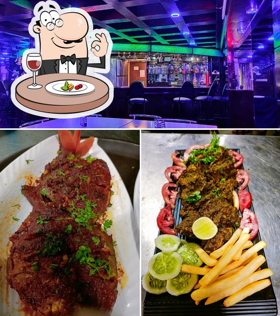 The picture of Top notch pub and cheers restaurant’s food and bar counter