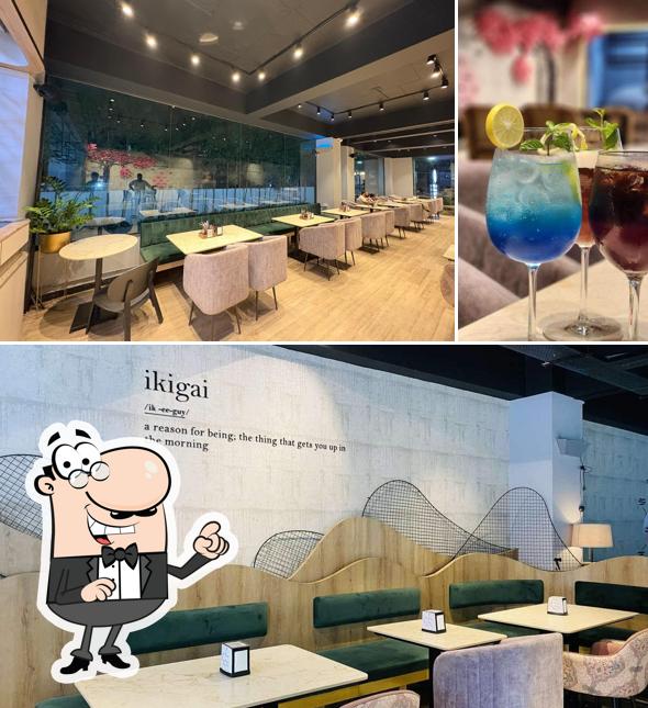 Check out the image showing interior and beverage at Café Ikigai - Whitefields, Kondapur