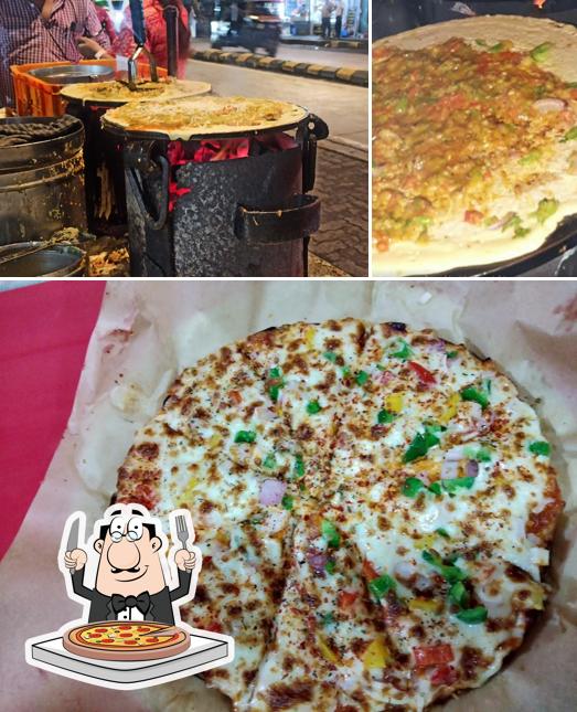 Try out pizza at Raju Dosa