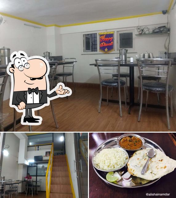 The photo of interior and food at Swad Veg Snacks And Dining