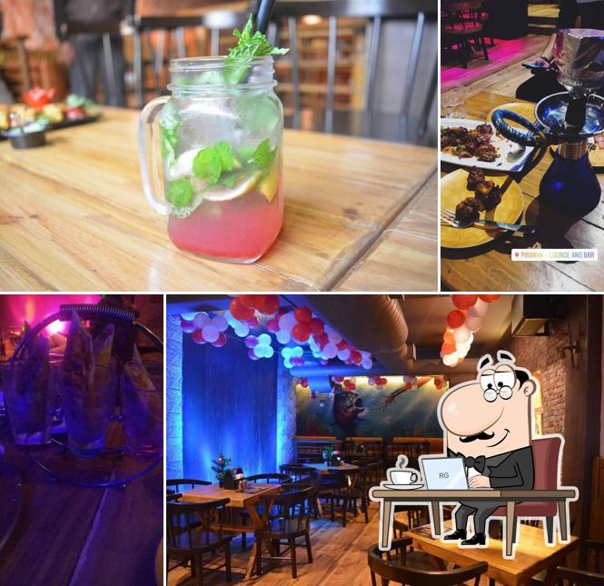 Take a seat at one of the tables at Piranha Lounge And Bar