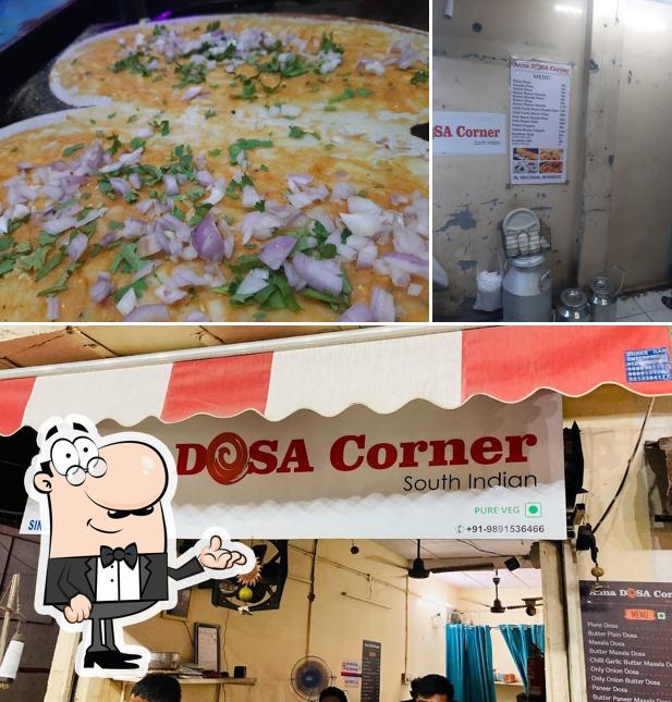 This is the image depicting interior and pizza at Anna Dosa Corner