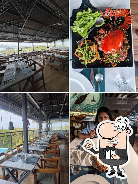 Take a seat at one of the tables at Seafood Delights Andaman Best Sea View Restaurant in Port Blair