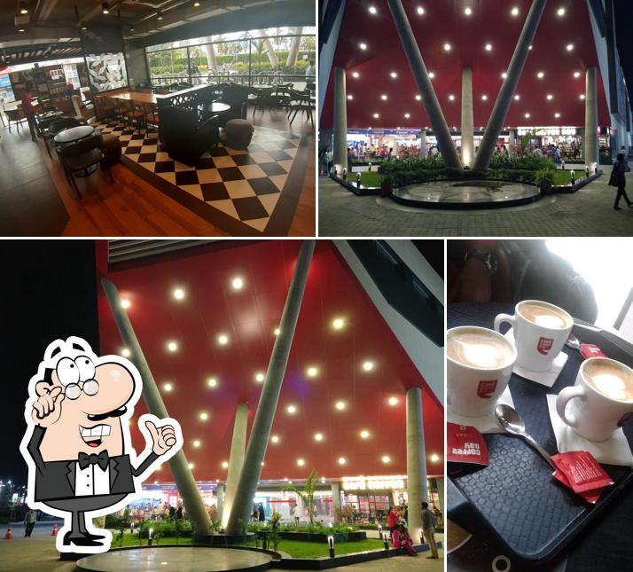 Take a seat at one of the tables at Café Coffee Day