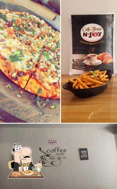 Check out the image showing food and exterior at Cafe Treat N Joy
