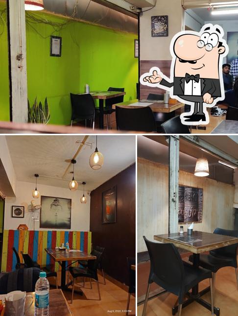 Take a seat at one of the tables at D Cafe' & Momos restaurant