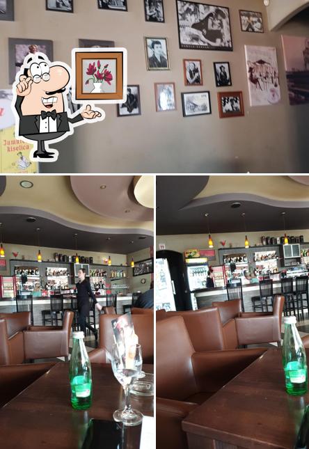 La immagine di interni e tavolo da pranzo da Lory Bar