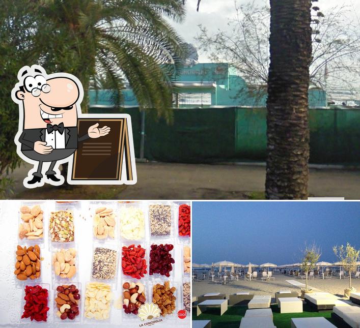 Dai un’occhiata alla foto che presenta la esterno e cibo di La Conchiglia Music