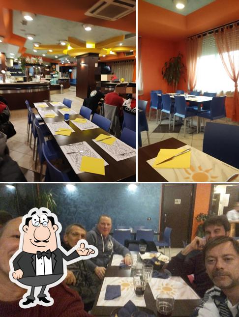 Dai un'occhiata agli interni di The Sun Pizzeria