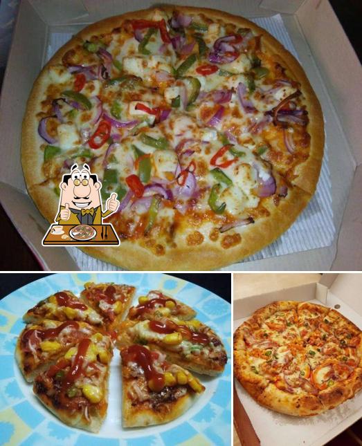 Try out pizza at Orchid Cafe